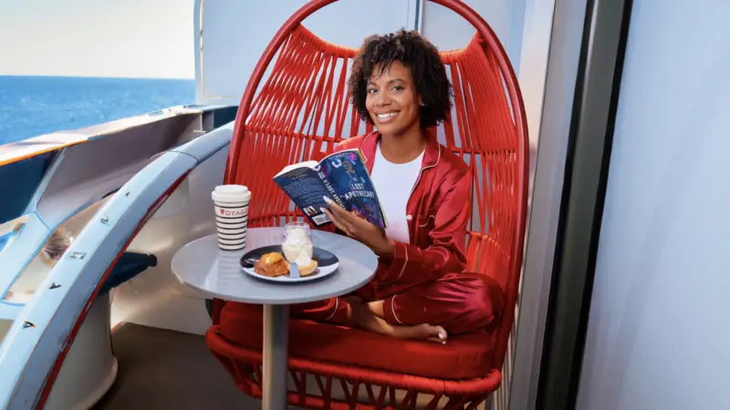 Red ratan chair with a person sitting in it